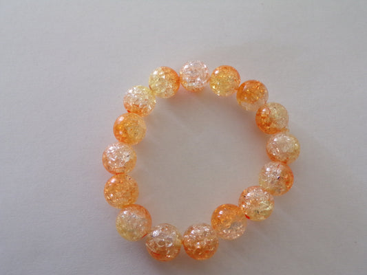 Toddler's orange bracelet