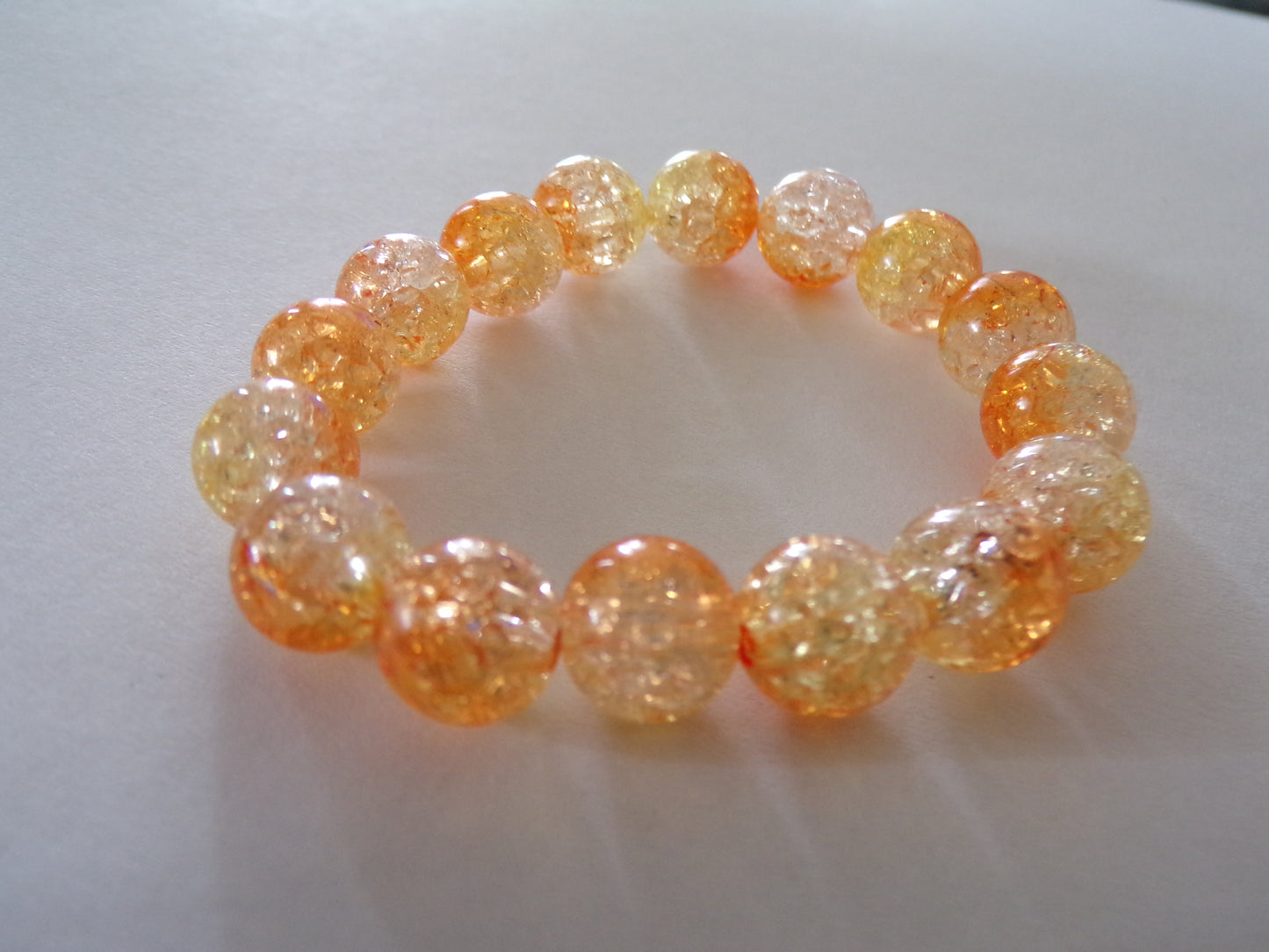 Toddler's orange bracelet